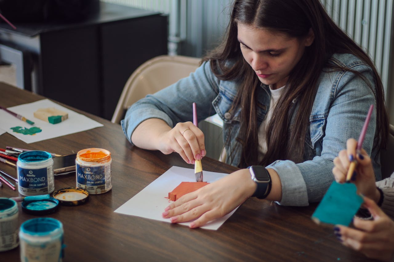 young-woman-engaged-in-creative-painting-activity-28619422